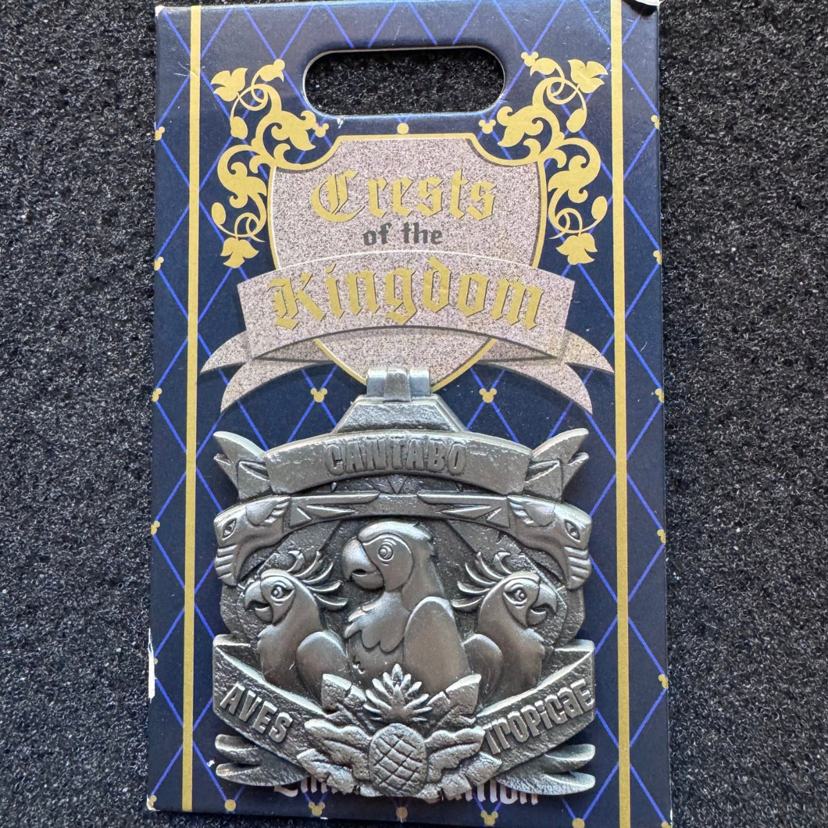 Enchanted Tiki Room "Aves Tropicae Cantabo" Crests of the Kingdom Pin